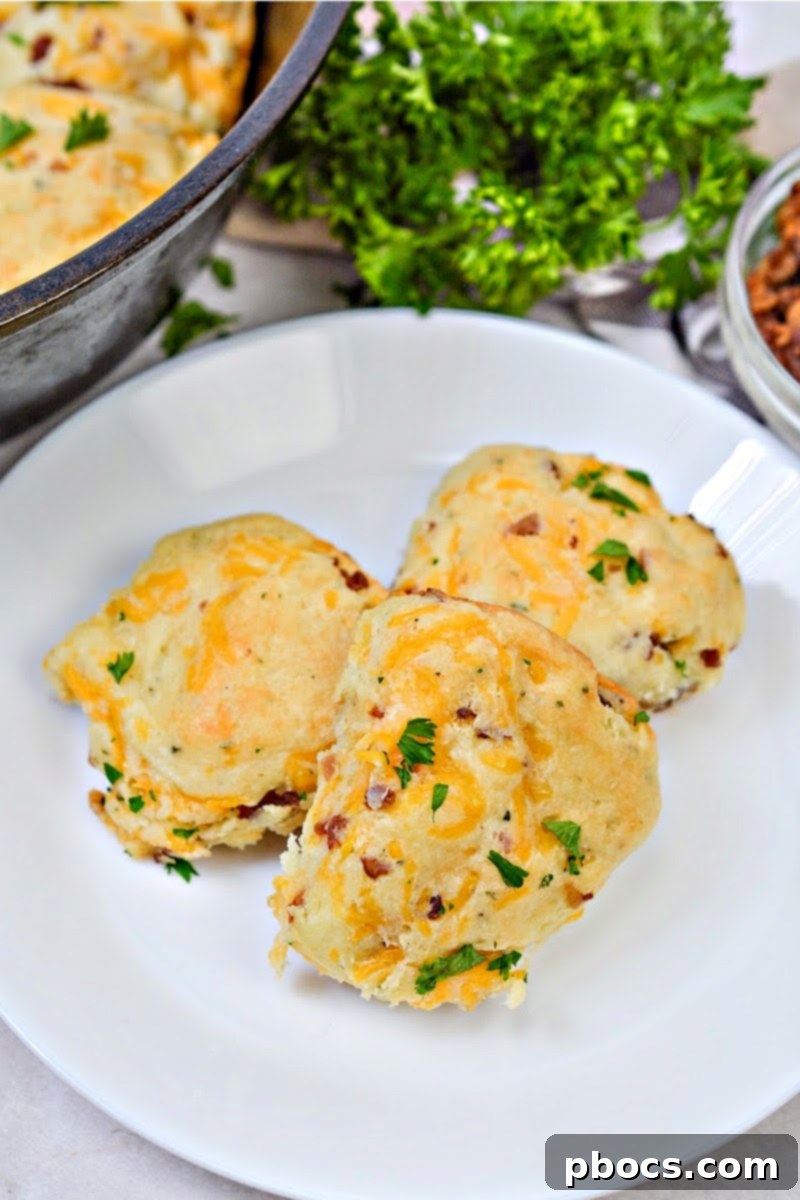 Keto Crave Biscuits 5 Keto Crack Biscuits - A close-up of a stack of biscuits, invitingly golden and ready to eat.