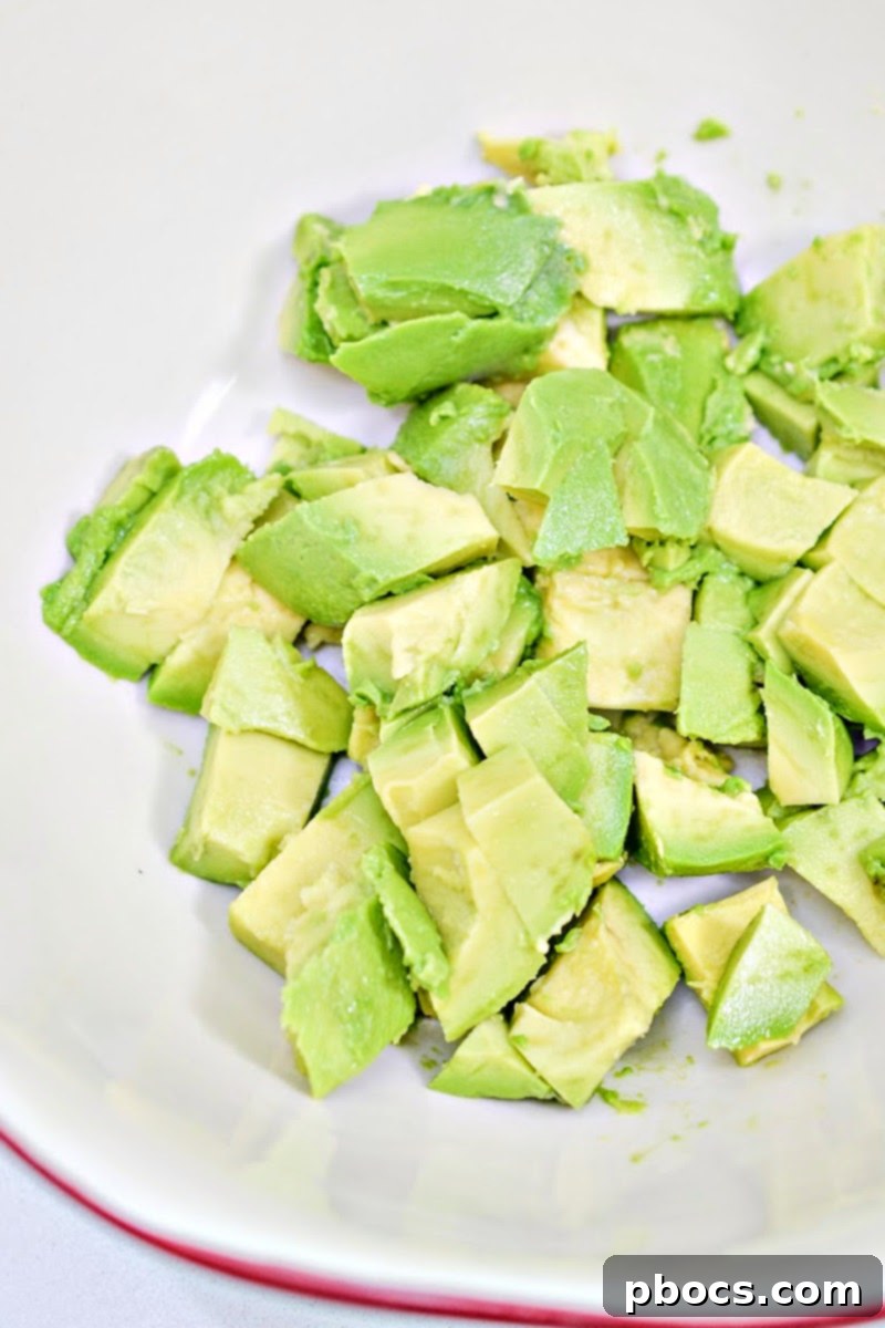 Mediterranean Avocado Feta Salsa 8 Mixing avocado, tomatoes, feta, and onion for low-carb feta salsa