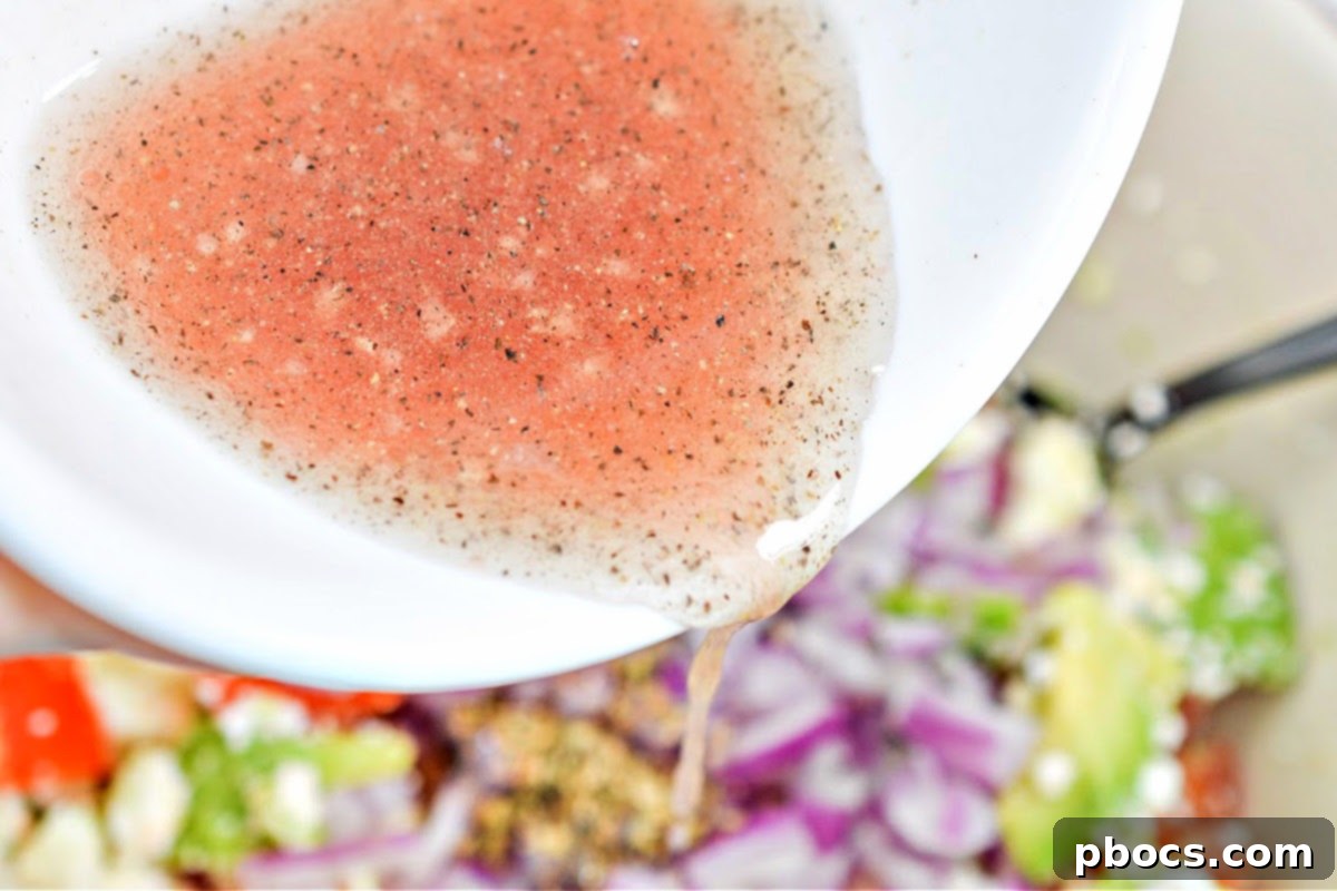 Mediterranean Avocado Feta Salsa 10 Tossing ingredients with dressing for low-carb avocado feta salsa