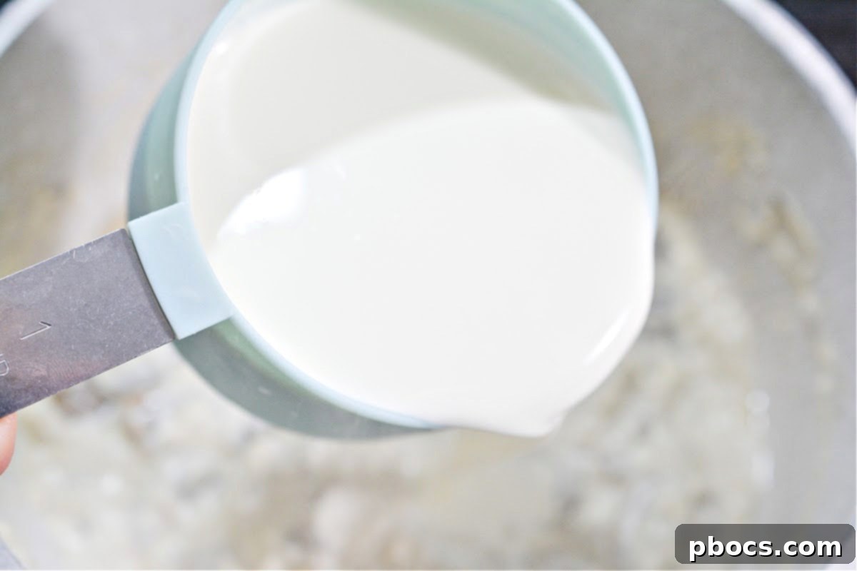 Heavy whipping cream thickening in a saucepan