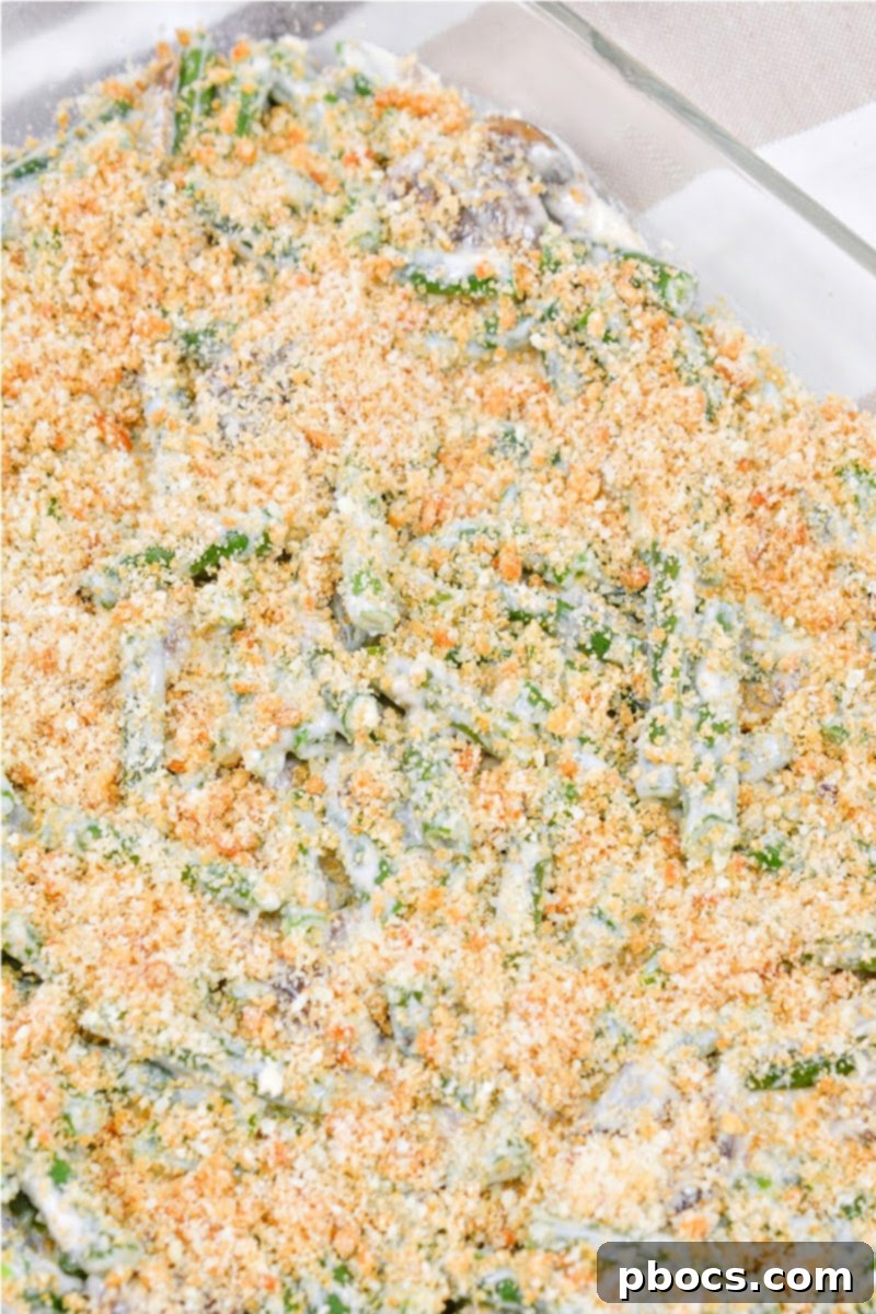 Mixing pork rind crumbs and Parmesan cheese