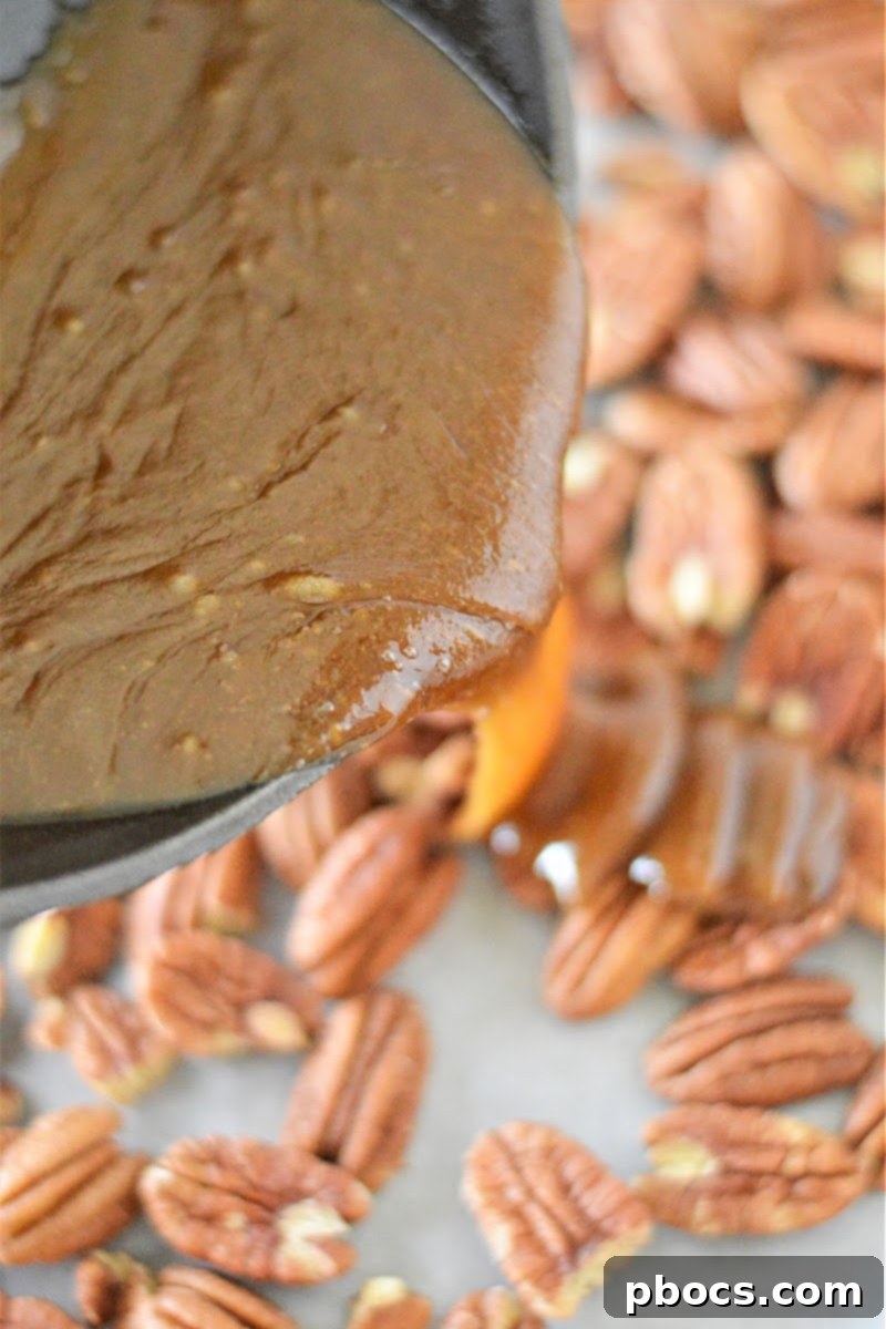 Coat pecans with caramel sauce