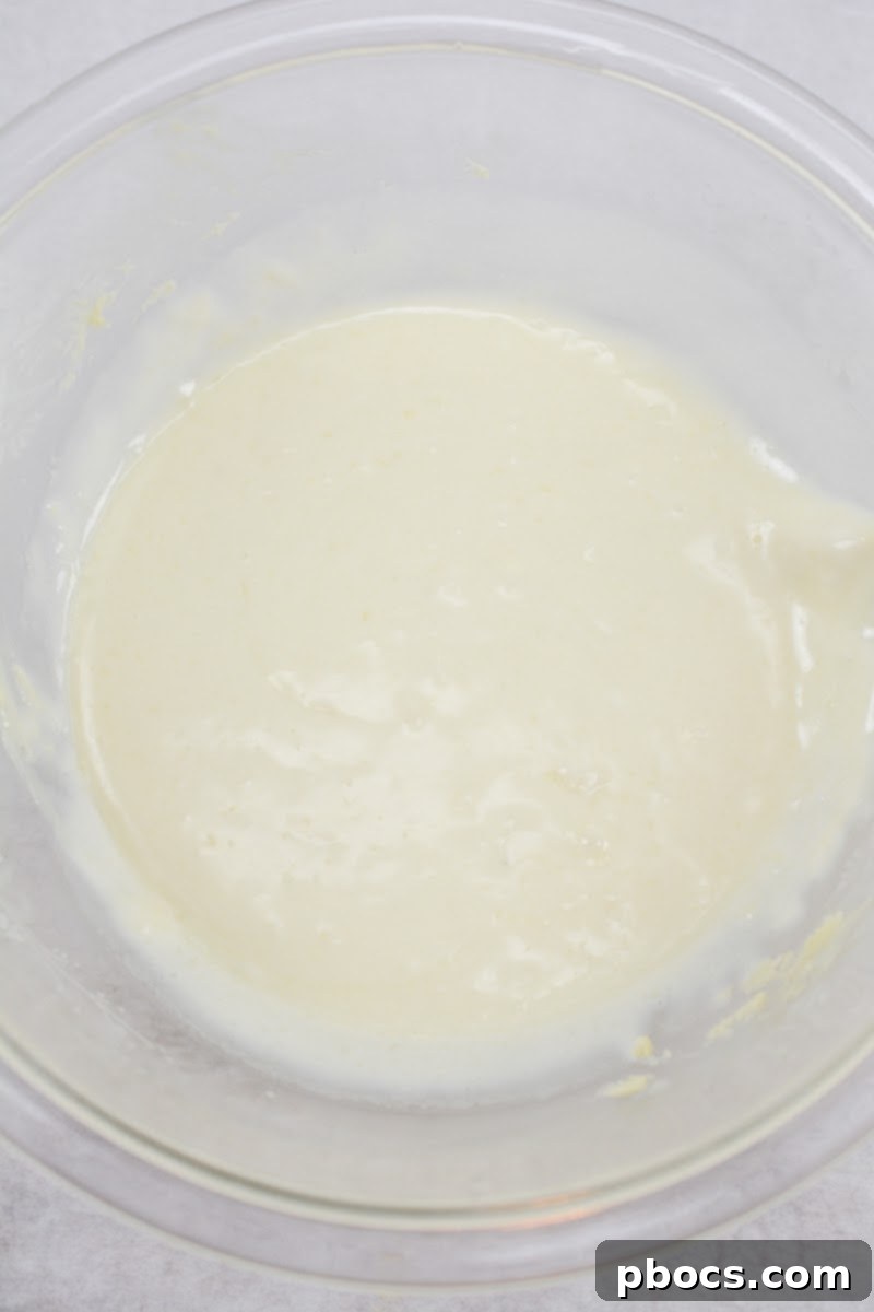 Decadent Keto White Chocolate Christmas Shooters 11 Keto white chocolate mixture chilling in a bowl.