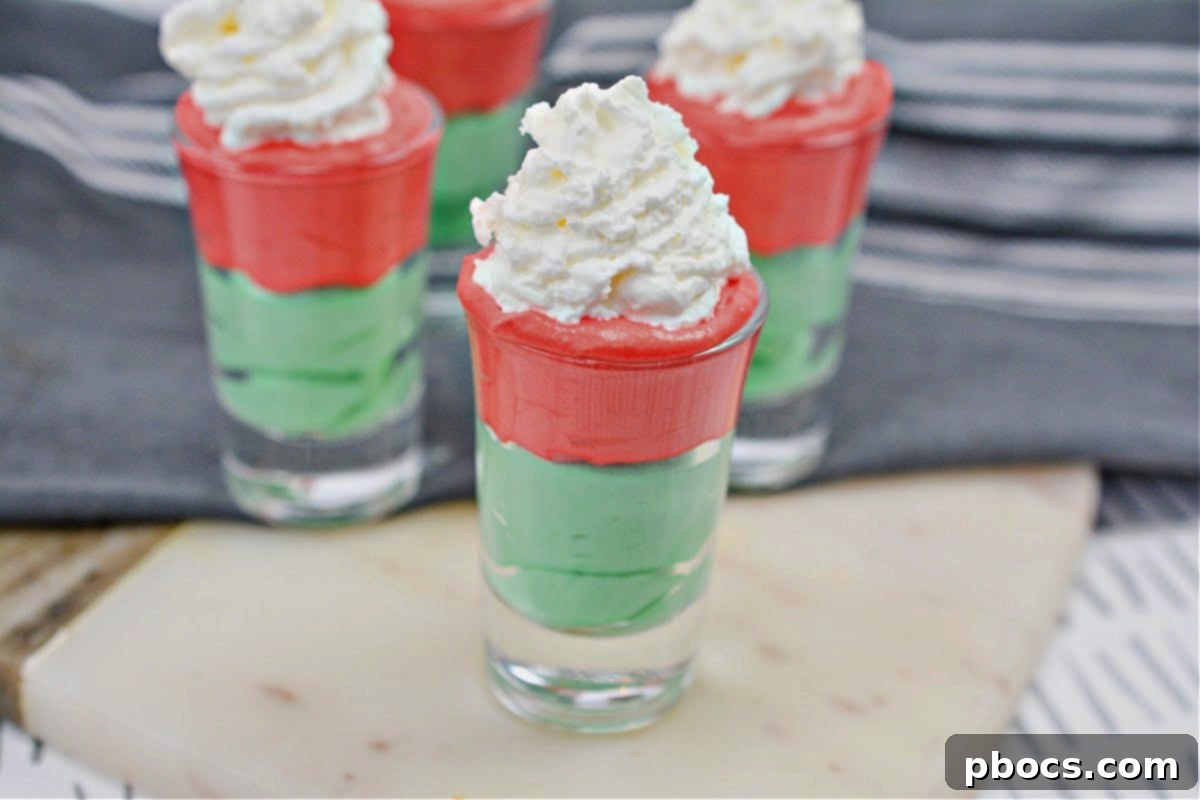 Decadent Keto White Chocolate Christmas Shooters 7 A festive spread of Keto White Chocolate Christmas Shooters and other holiday treats on a table.