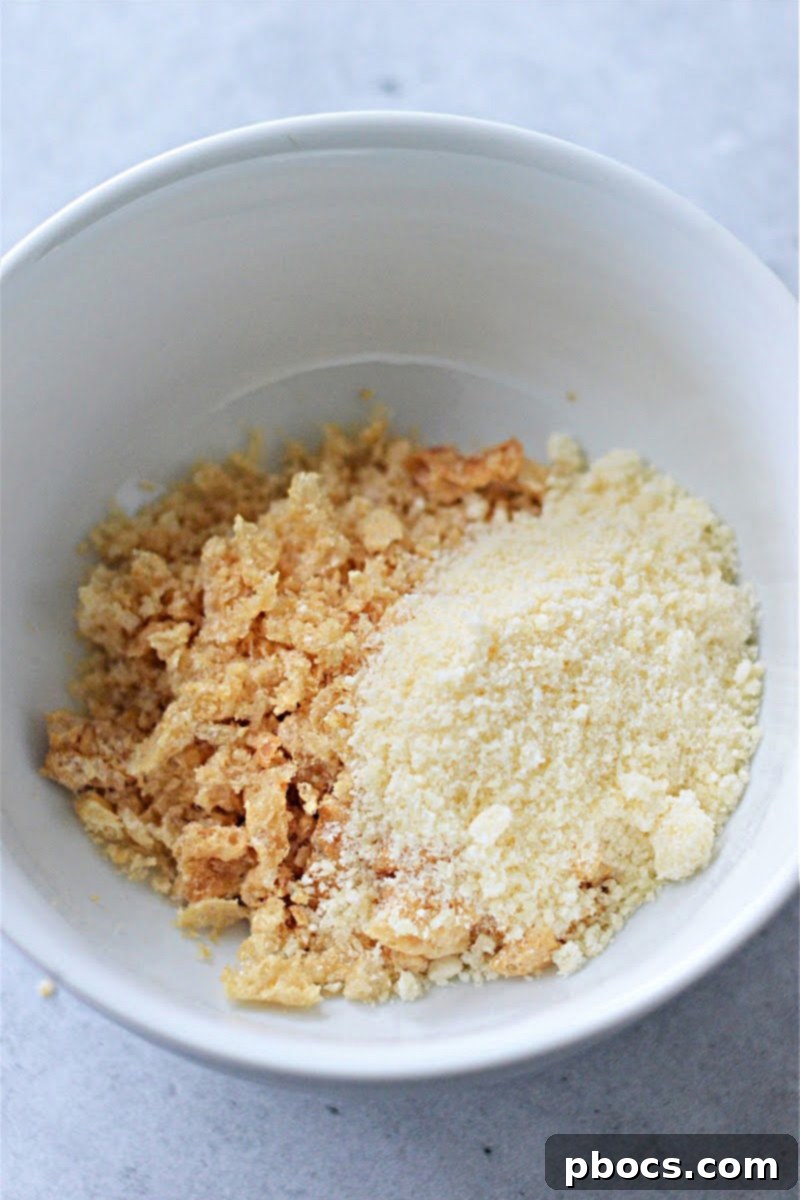 Creamy Keto Crab Rangoon Casserole 14 Parmesan cheese and crushed pork rinds in a bowl