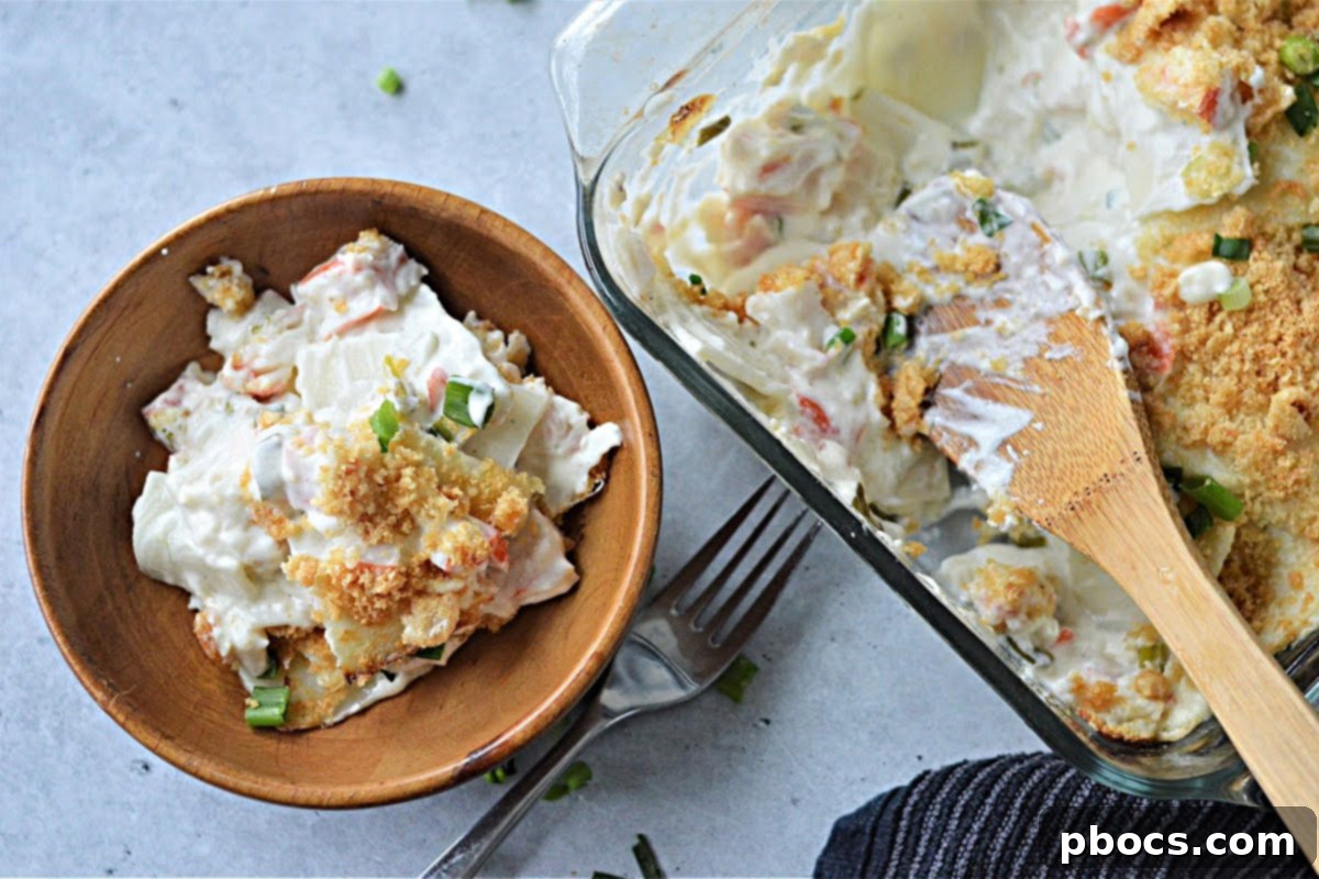 Creamy Keto Crab Rangoon Casserole 6 Baked Keto Crab Rangoon Casserole garnished with green onions