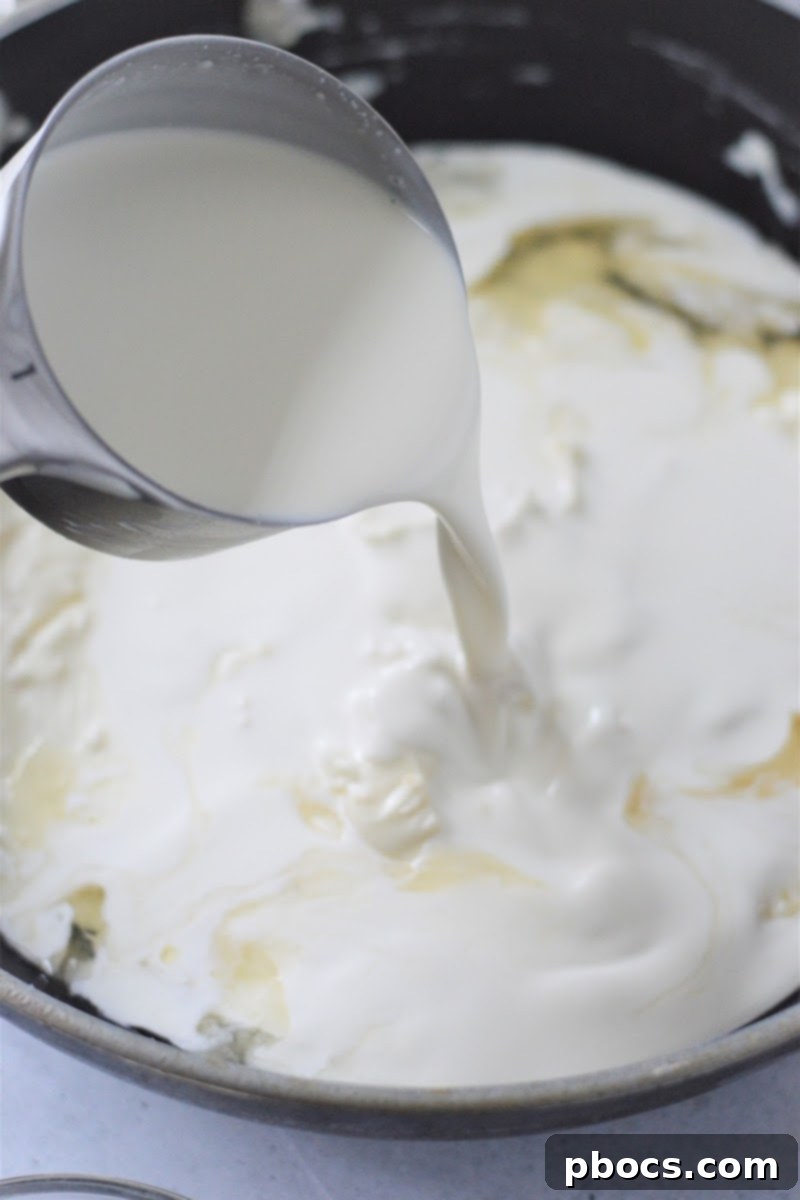 Creamy Keto Crab Rangoon Casserole 10 Cream cheese, broth, and heavy cream in a saucepan