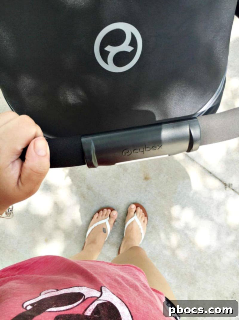 CYBEX Aton Q infant car seat with Balios M stroller in a park setting