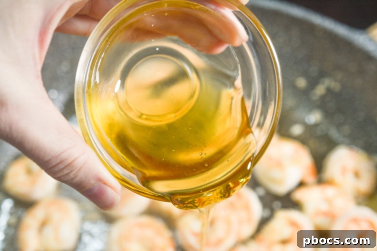 Sticky Honey-Garlic Keto Shrimp 9 Shrimp turning pink and opaque while cooking
