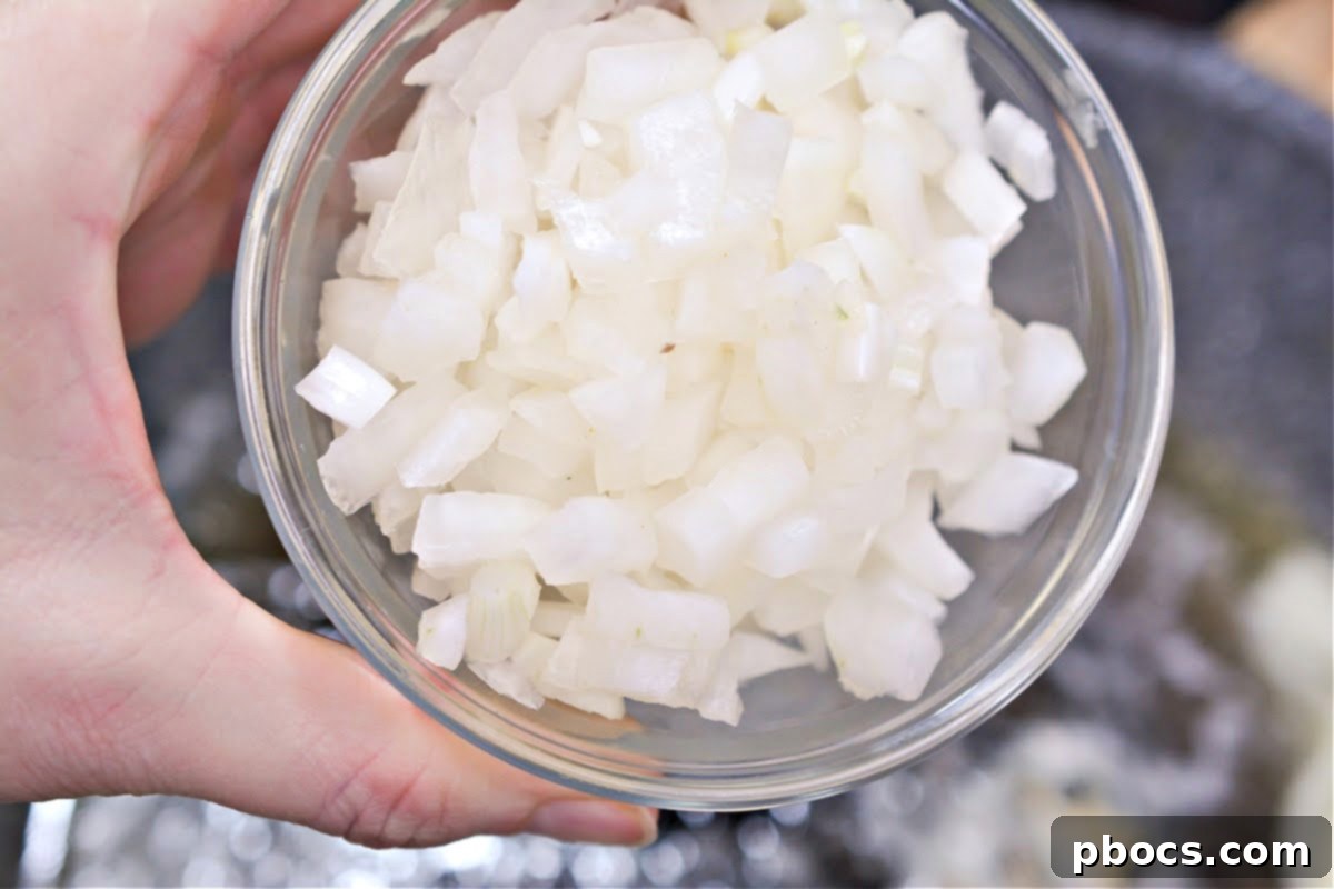 Adding butter for Keto Chicken Tikka Masala sauce