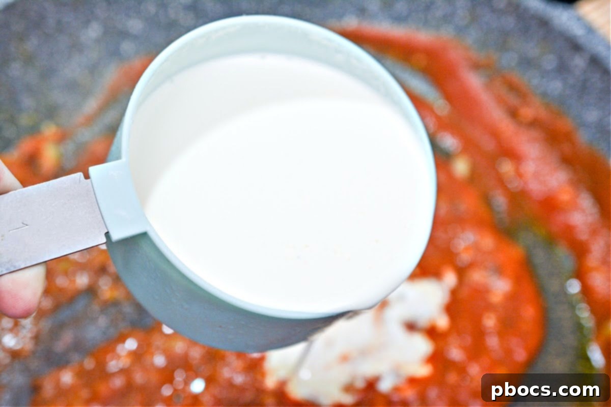 Adding wet ingredients for Keto Chicken Tikka Masala sauce