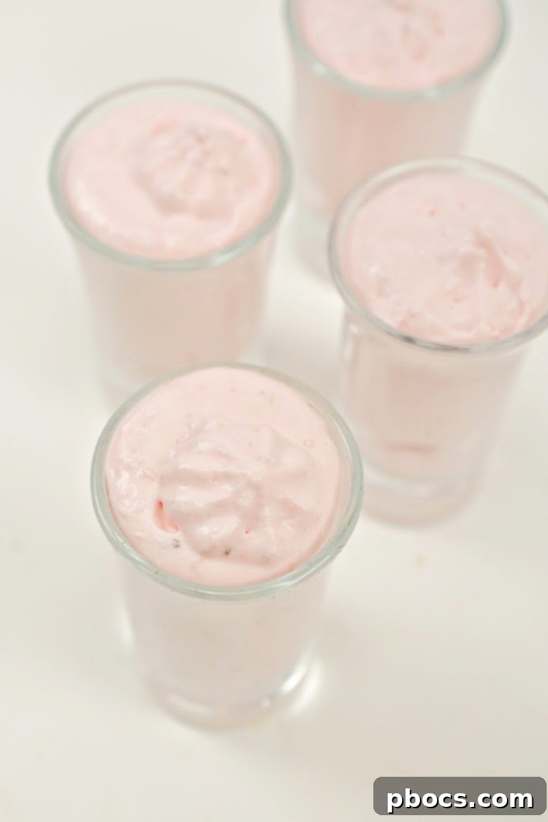 Folding strawberry mixture into whipped cream