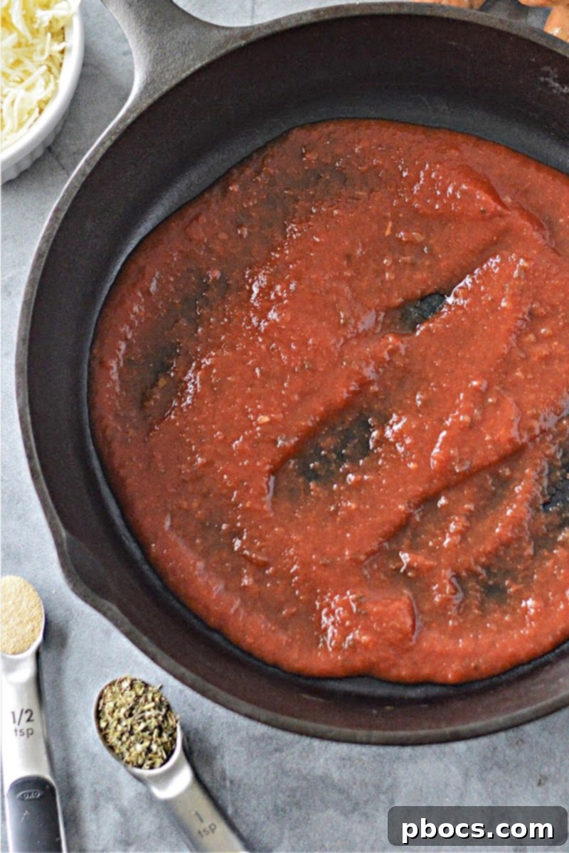 Preparing the Baking Dish with Marinara Sauce