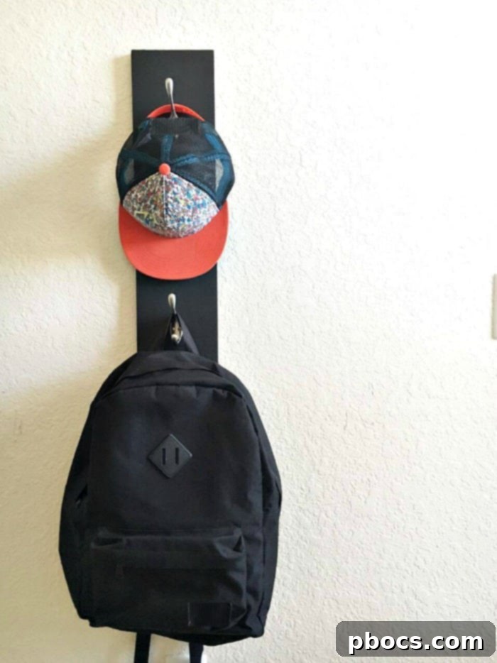 DIY Chalkboard Backpack Organizer 11 Kids' backpacks and hats hanging on the new DIY Chalkboard Backpack Rack