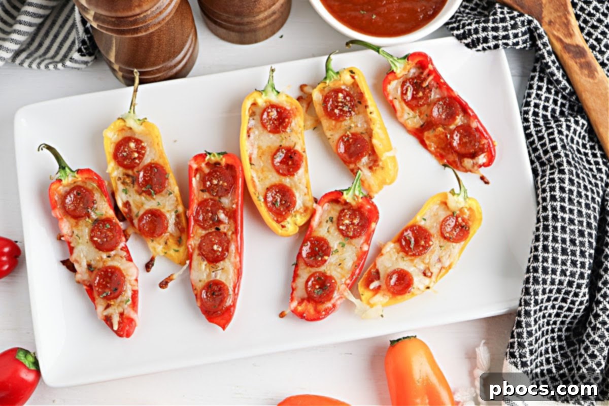 Close-up of baked Low-Carb Pizza Pepper Poppers, showcasing melted cheese and pepperoni