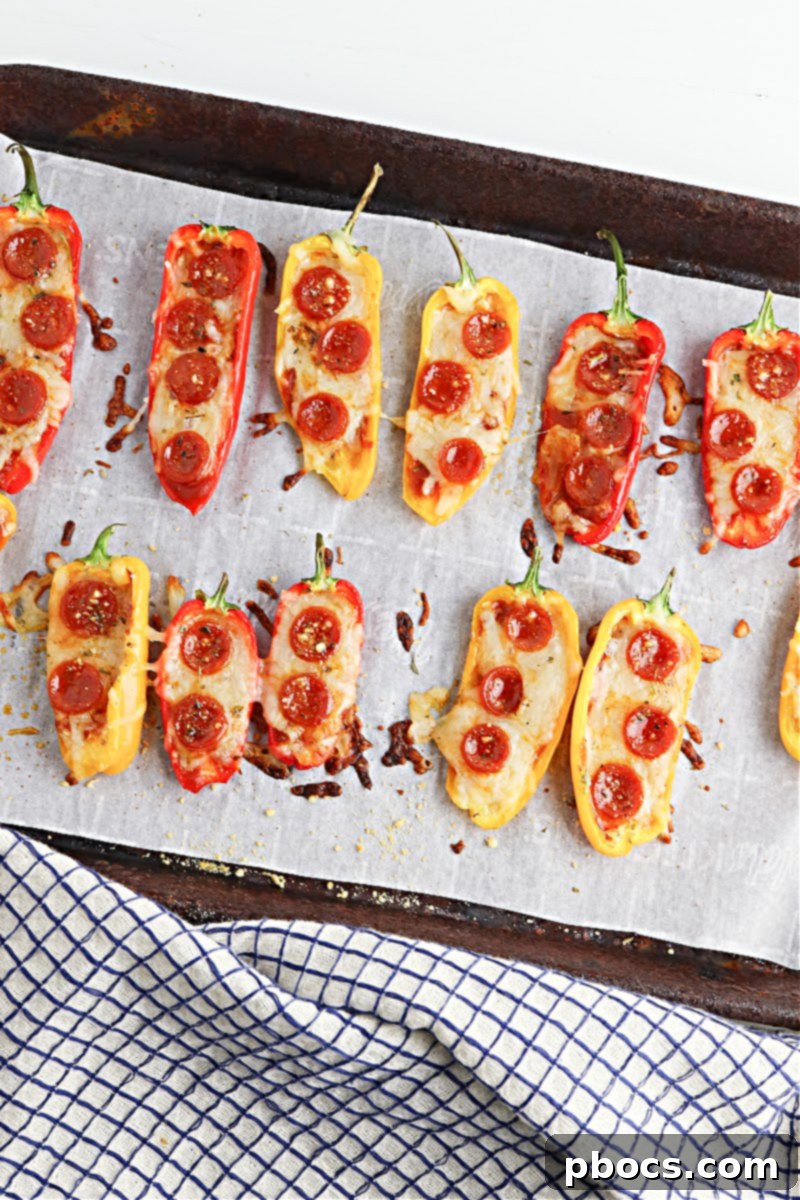 Freshly stuffed Low-Carb Pizza Pepper Poppers with pepperoni, cheese, and seasoning, ready for baking