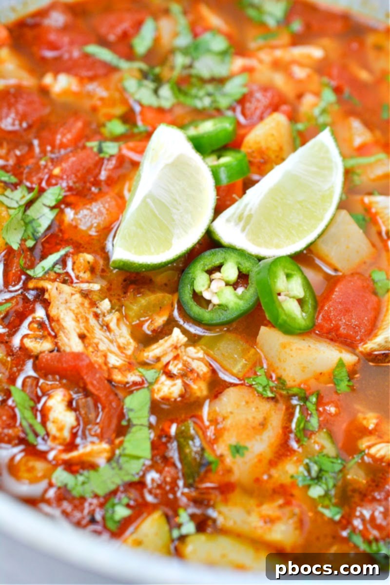 Hearty Low-Carb Chicken Caldo De Pollo in a rustic bowl