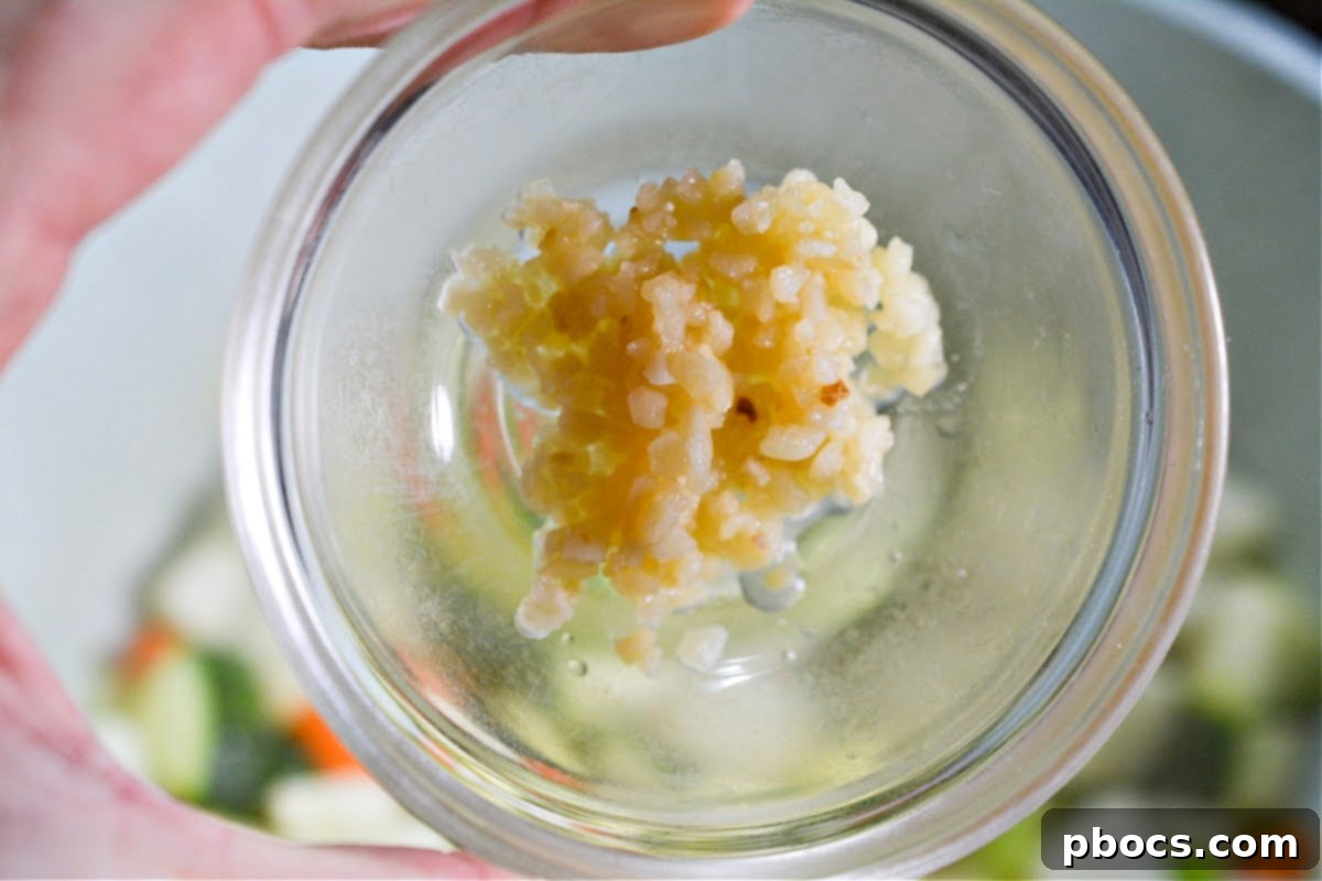 Adding spices to the sautéed vegetables