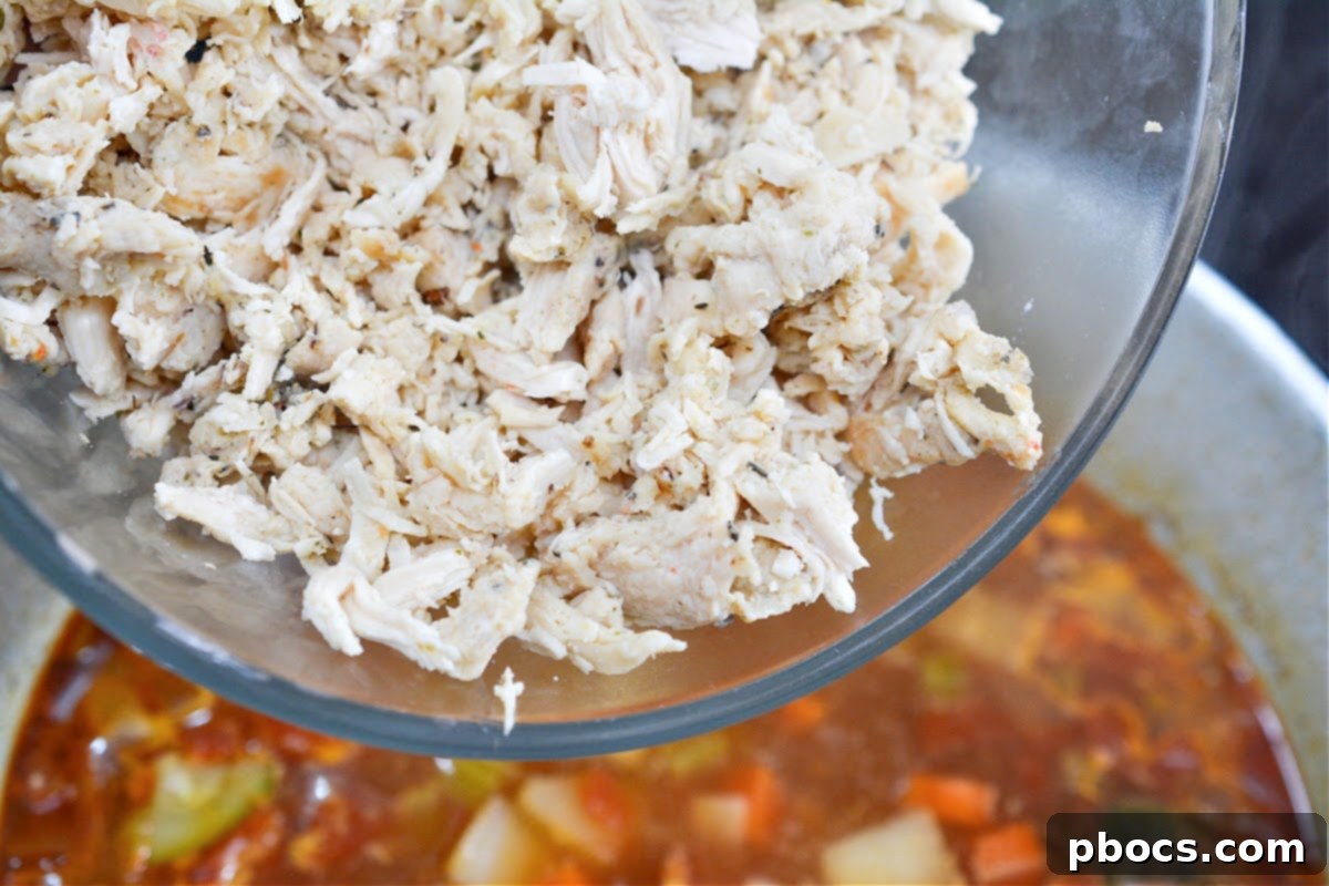 Pot of Caldo De Pollo simmering on the stove