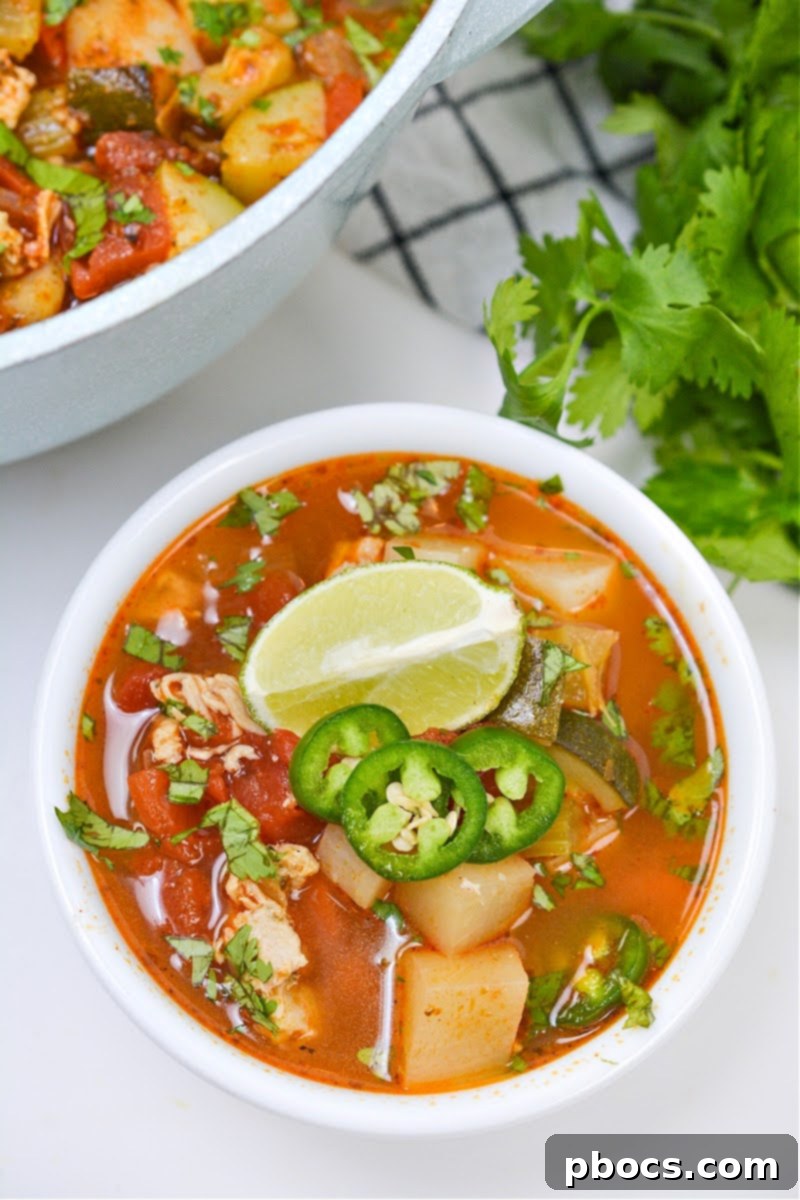 Adding chili powder and cumin to sauteed vegetables in a pot