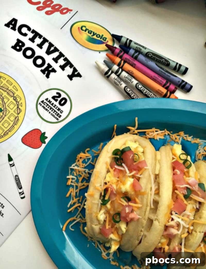 Close-up of a perfectly filled Eggo Waffle Taco with eggs and fresh toppings