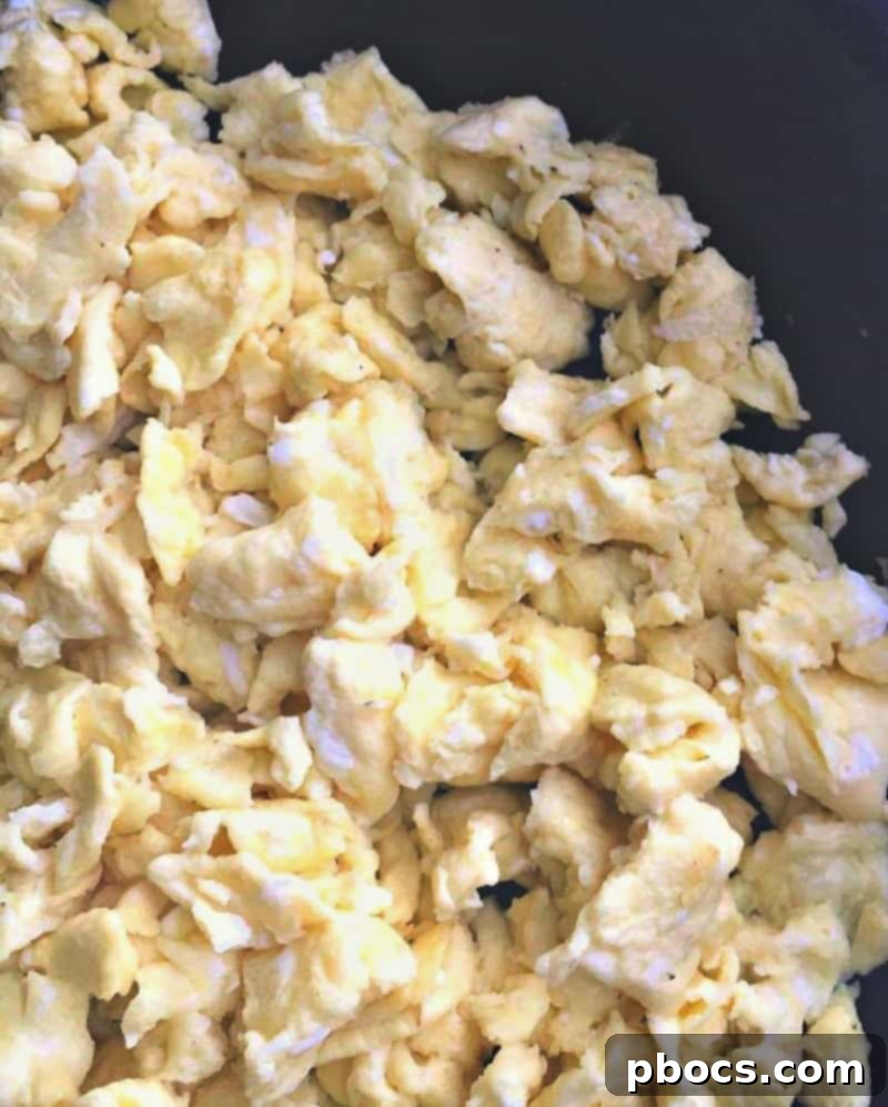 Preparing scrambled eggs for Eggo Waffle Tacos