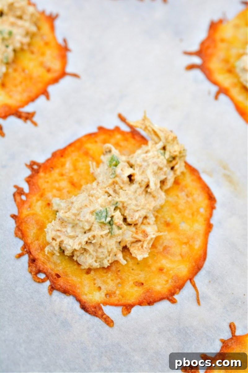 Removing baked cheese wraps from oven to cool slightly