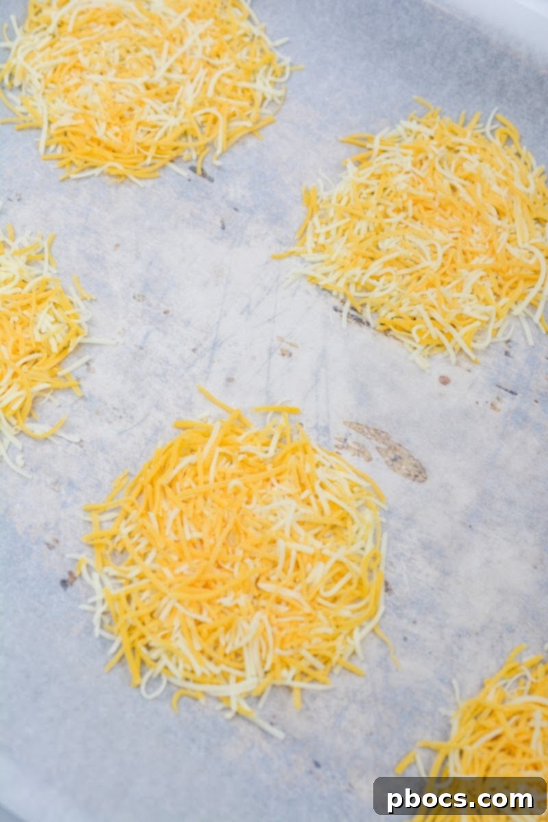 Forming cheese circles on parchment paper for keto wraps