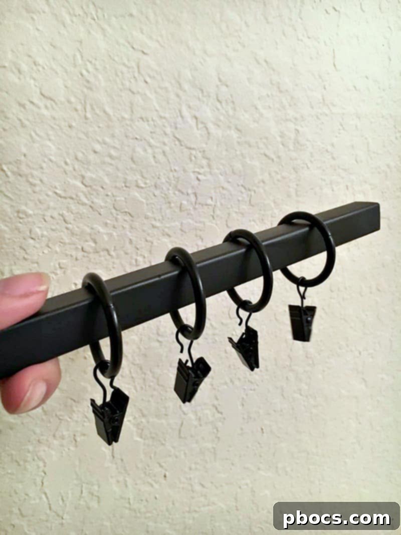 Sliding curtain rings onto the towel bar