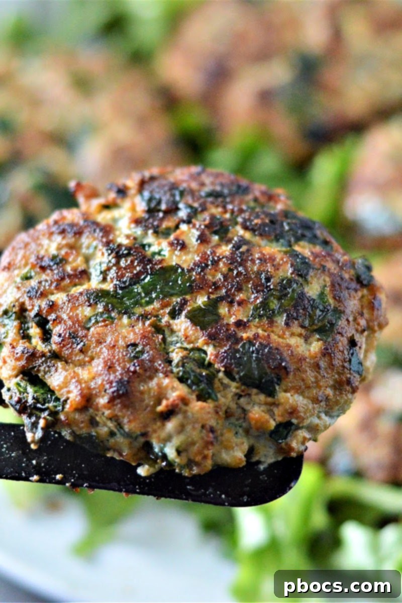 Cooked Keto Spinach Feta Turkey Burgers cooling in the skillet