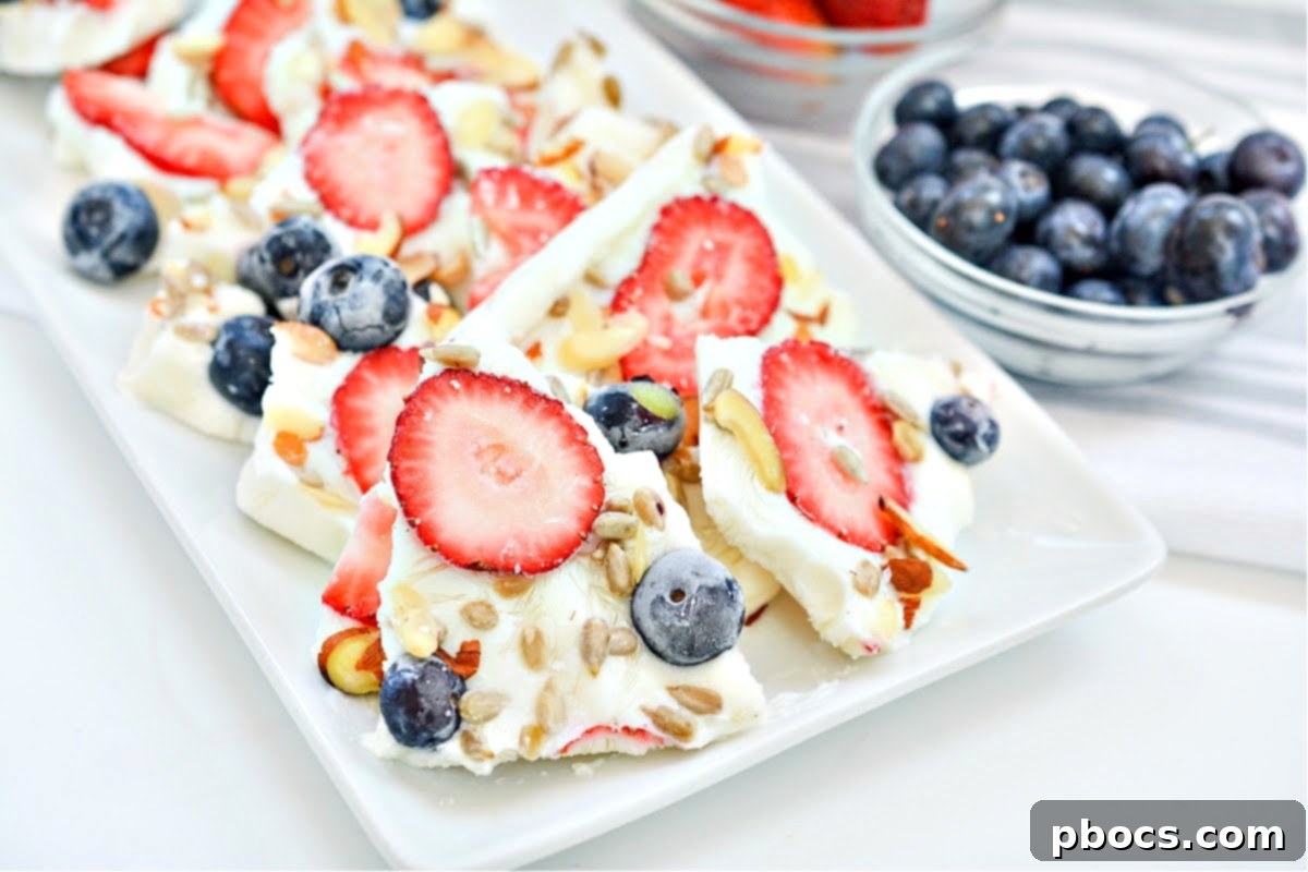 Close-up of frozen yogurt bark pieces with berries and nuts
