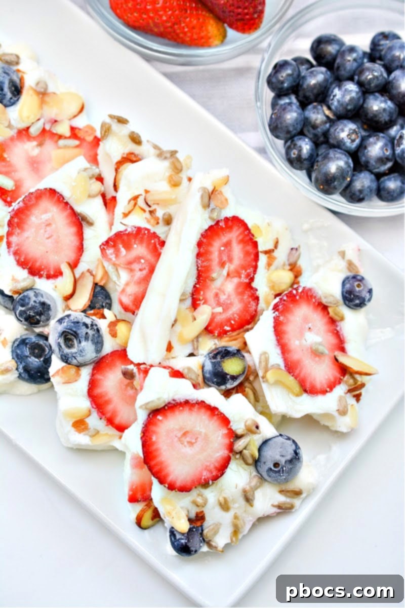 Keto frozen yogurt bark with various keto-friendly fruits