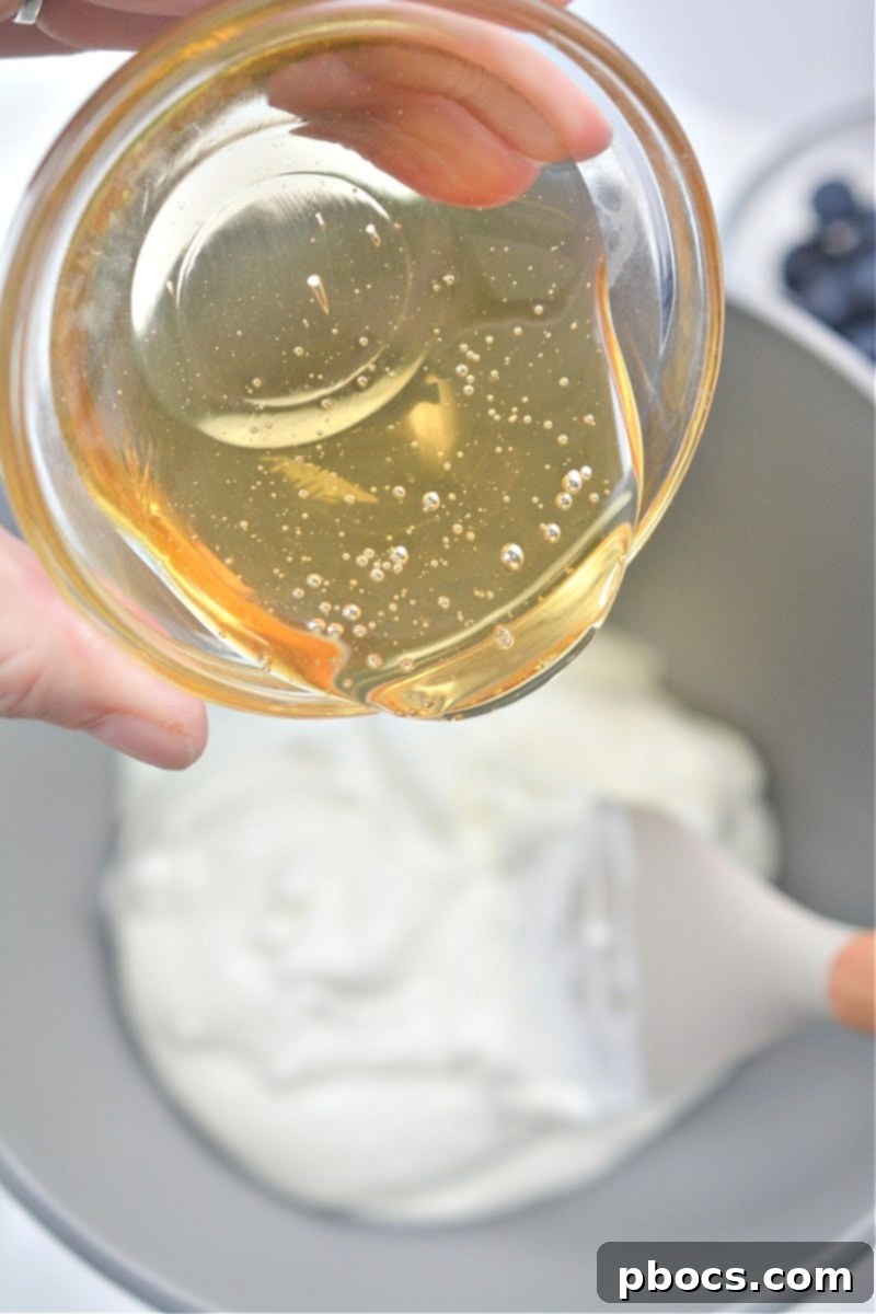 Spreading yogurt mixture onto a parchment-lined baking sheet