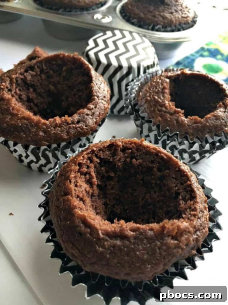 The hollowed-out center of a cupcake, ready for filling