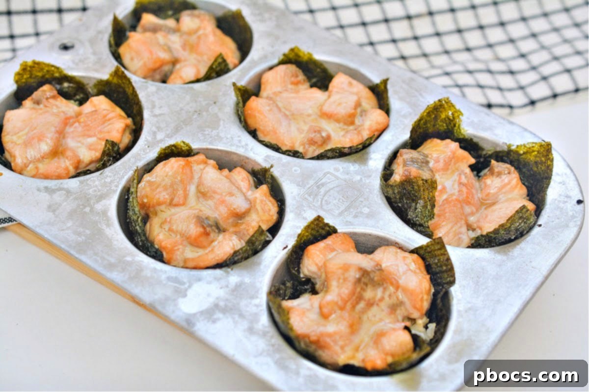 Cooked salmon in nori cups, still in the muffin tin, fresh from the oven