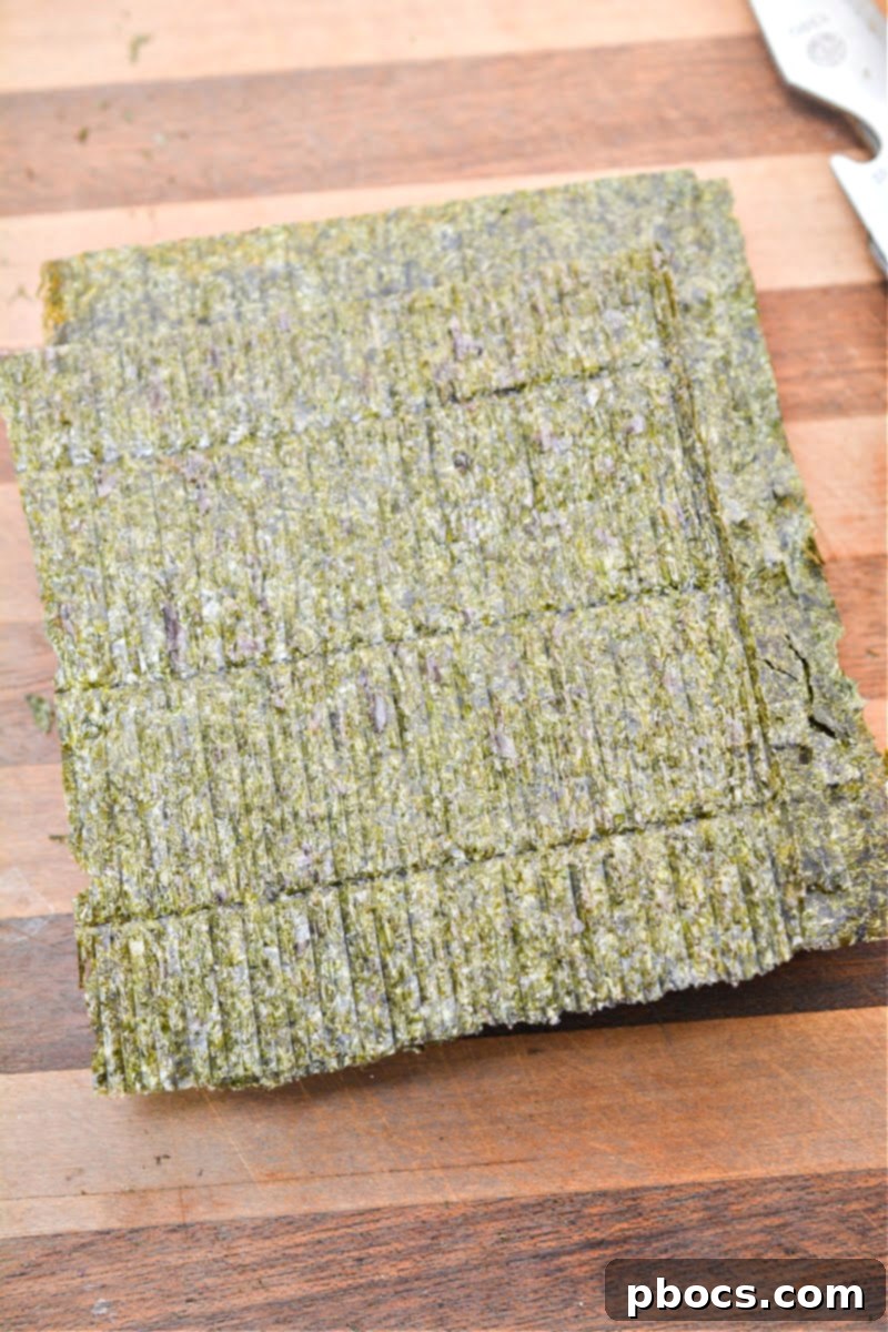 A single sheet of crisp, dark green Nori seaweed