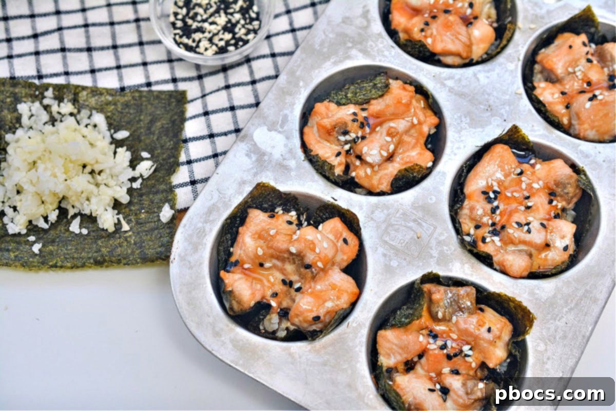 Salmon Sushi Nori Cups arranged in a muffin tin before baking