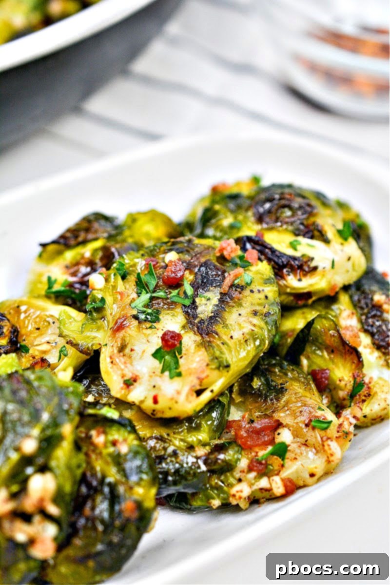 A plate of perfectly caramelized Keto Smashed Brown Butter Brussels Sprouts, ready to be served as a delicious low-carb side dish.