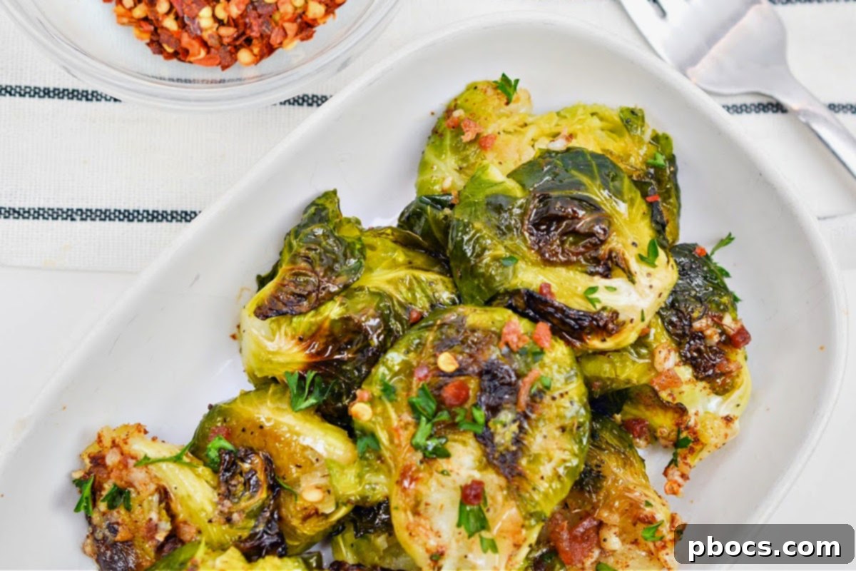 A beautifully arranged serving of Keto Smashed Brown Butter Brussels Sprouts on a plate, ready for a delightful low-carb meal.