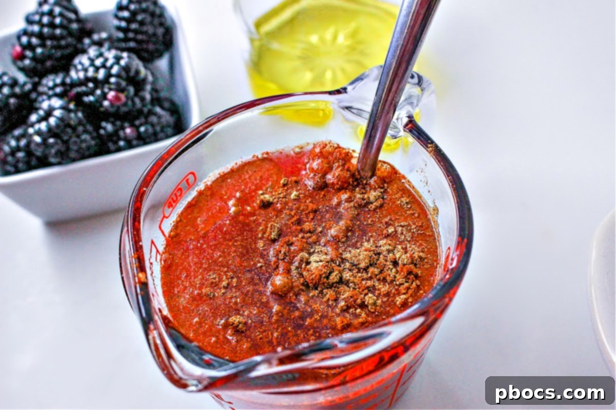 Making the blackberry sauce in a glass measuring cup