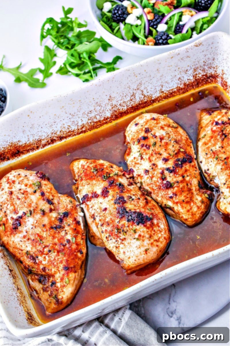 A casserole dish with baked blackberry chicken