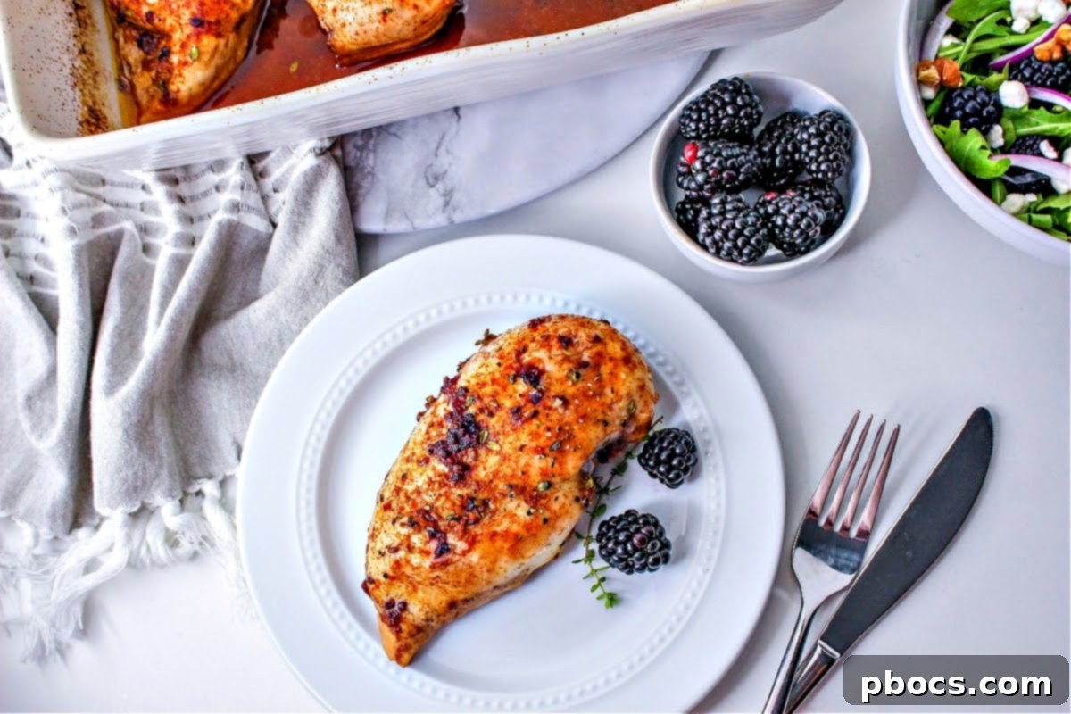 A white plate with Keto Blackberry Chicken