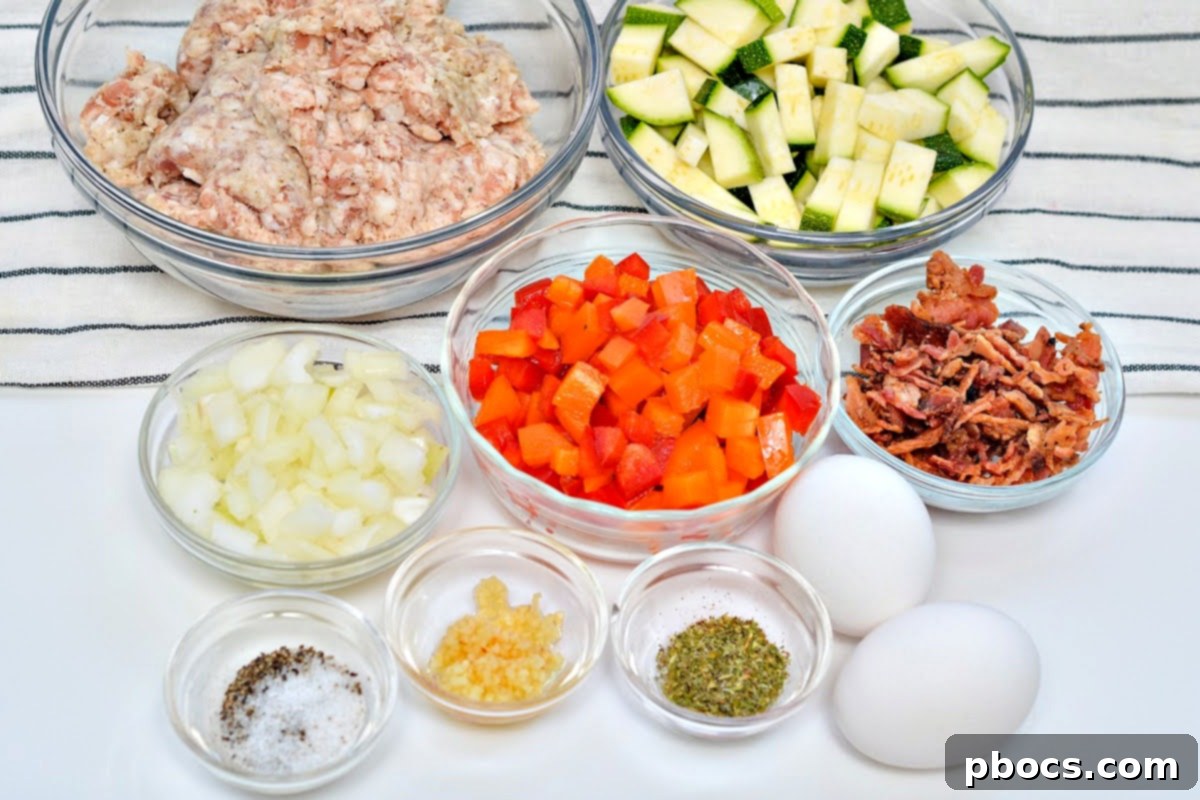 Keto Sausage Zucchini Breakfast Skillet 8 A selection of fresh ingredients laid out: ground sausage, chopped zucchini, bell peppers, and onions, ready for the Keto Zucchini Breakfast Hash.