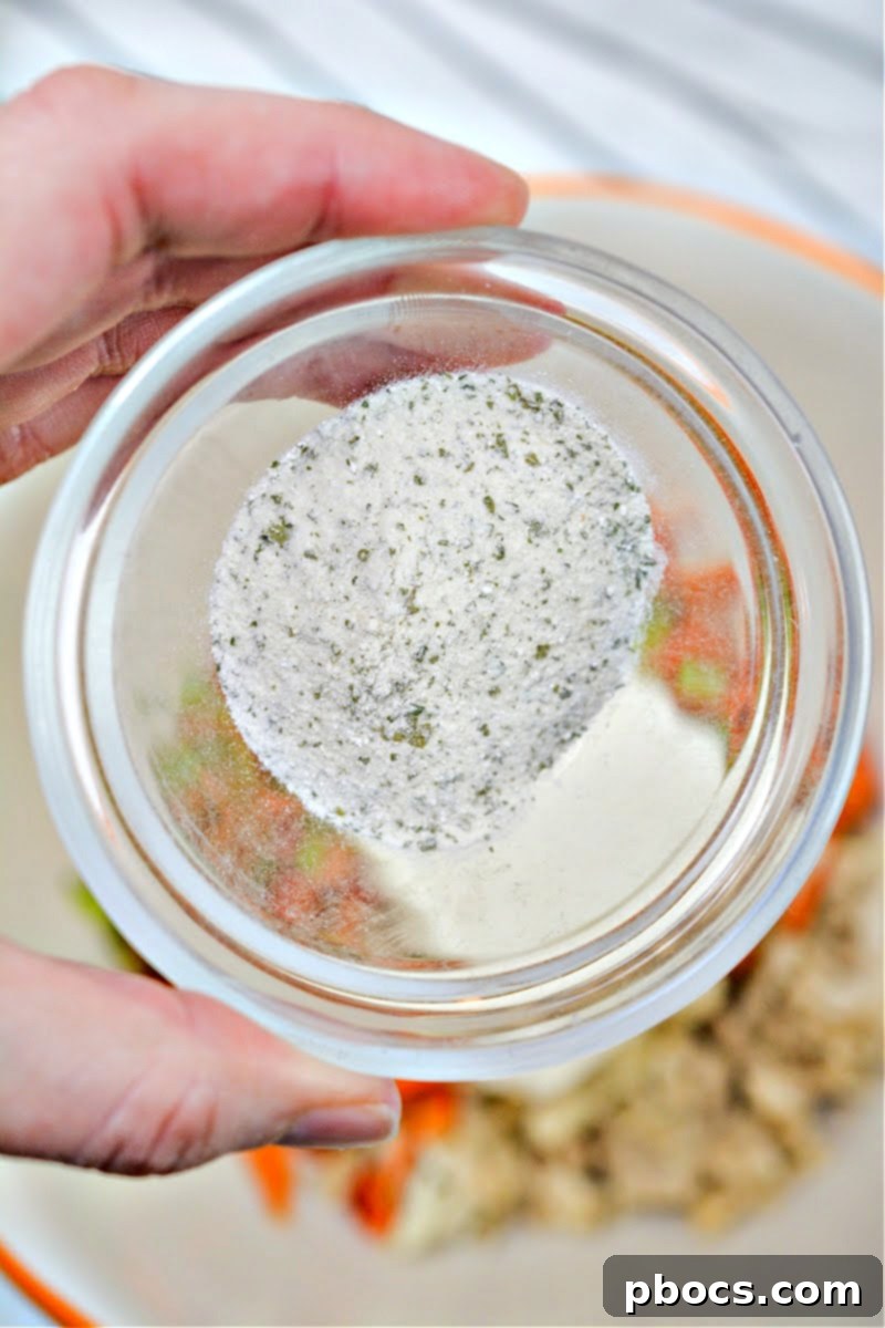 Dry ranch seasoning in a small white bowl, ready to be mixed.