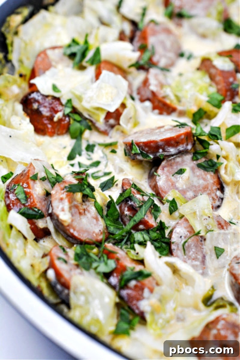 A skillet of cabbage and sausage alfredo