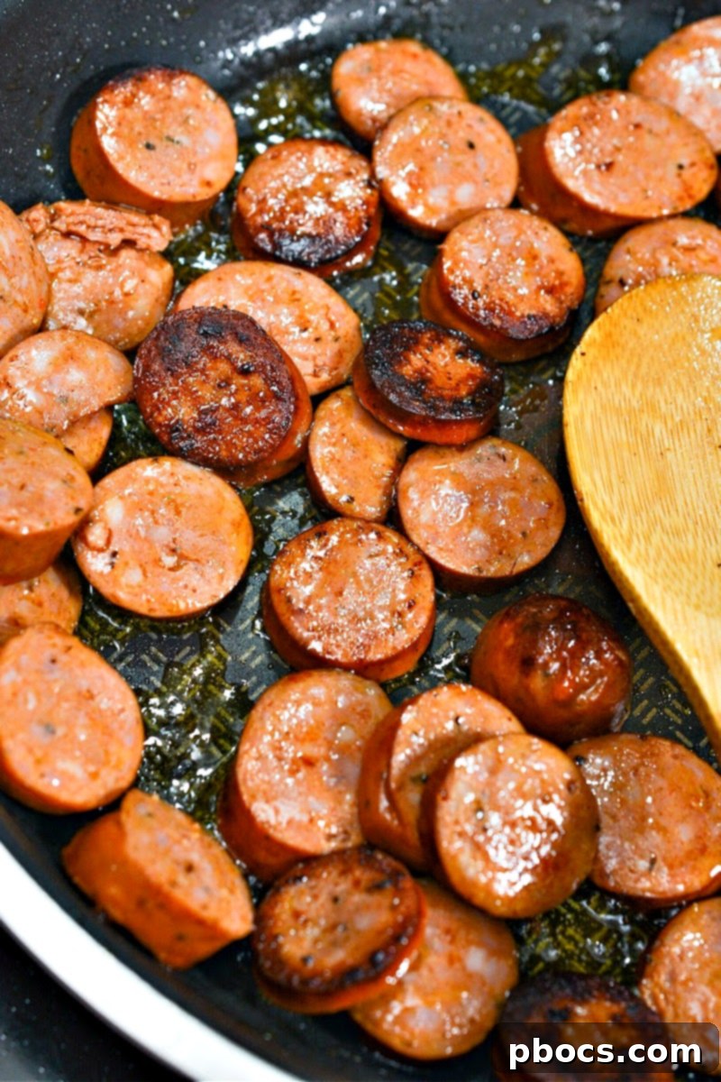 Cooking sliced sausage in a skillet
