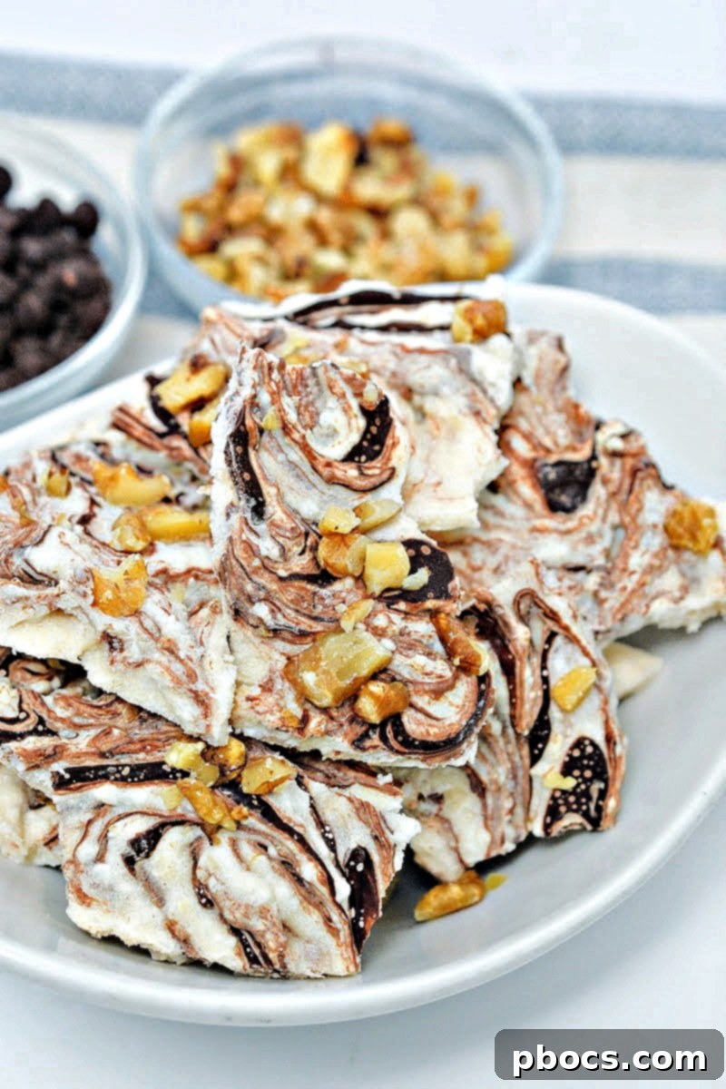 Keto Cottage Cheese Freezer Bark 7 Several pieces of Keto Frozen Cottage Cheese Bark on a baking sheet