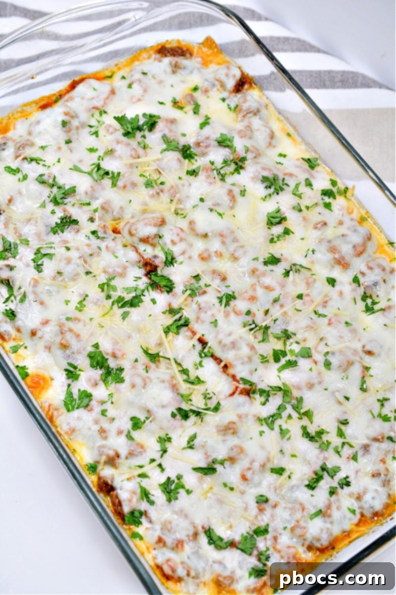 Baked Keto Protein Lasagna garnished with shredded Parmesan cheese