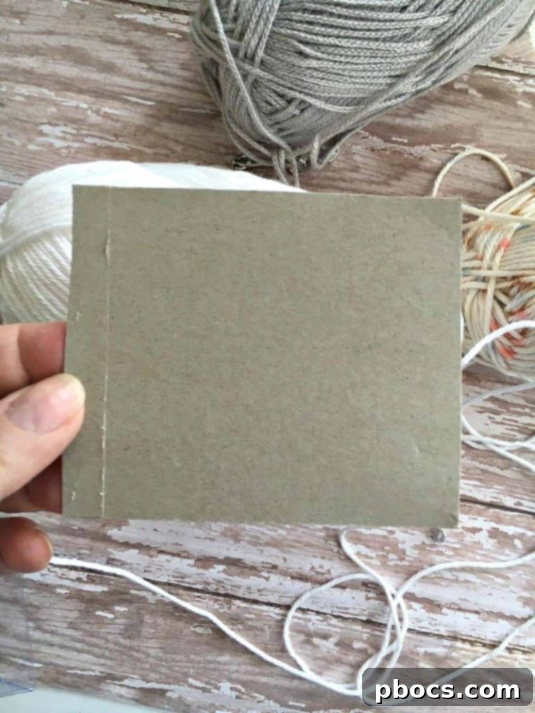 Crafting Adorable Pompom Keychains 6 DIY Pompom Keychain - Wrapping yarn around cardboard