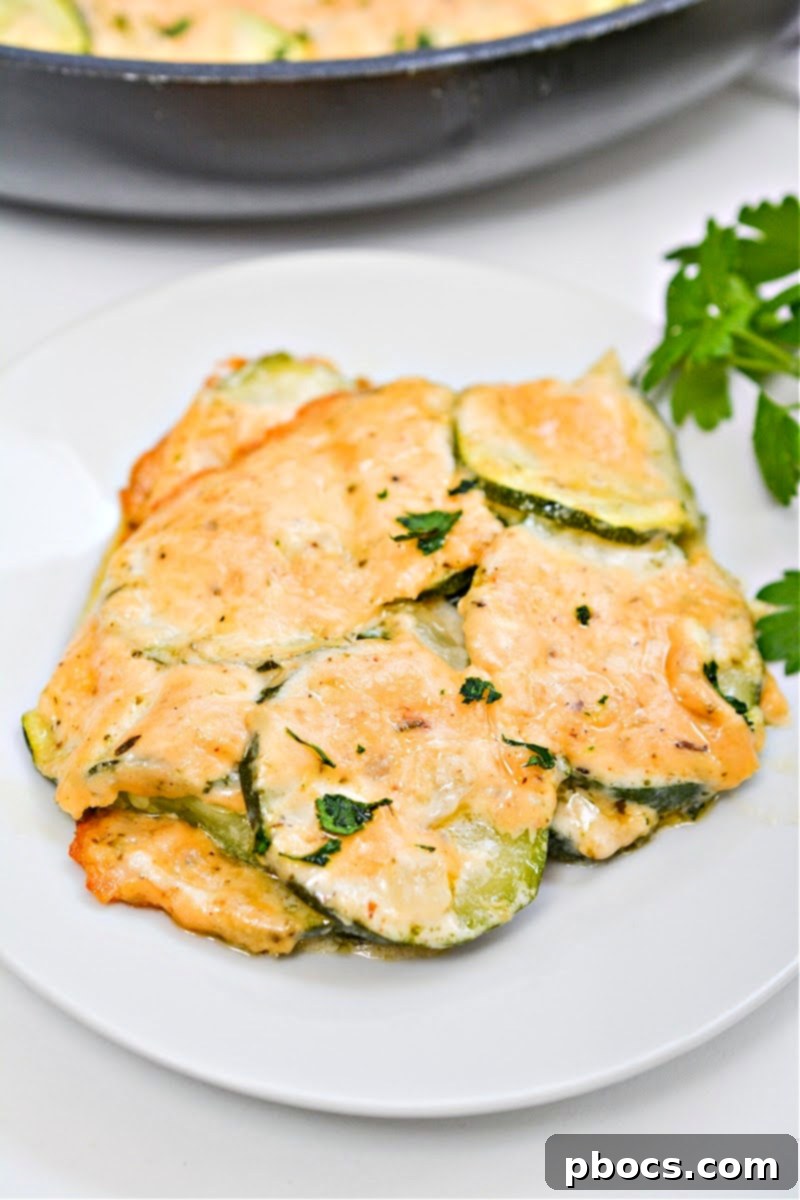 Keto Scalloped Zucchini, a creamy and cheesy low-carb side dish perfect for family dinners or keto dieters.